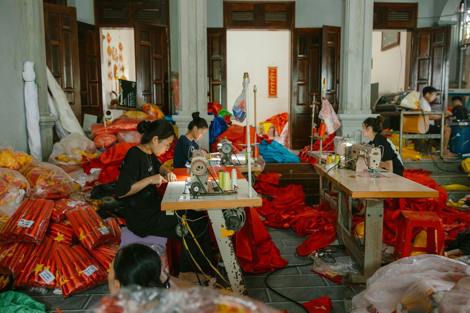 Workers at sewing machines in a workshop in Vietnam