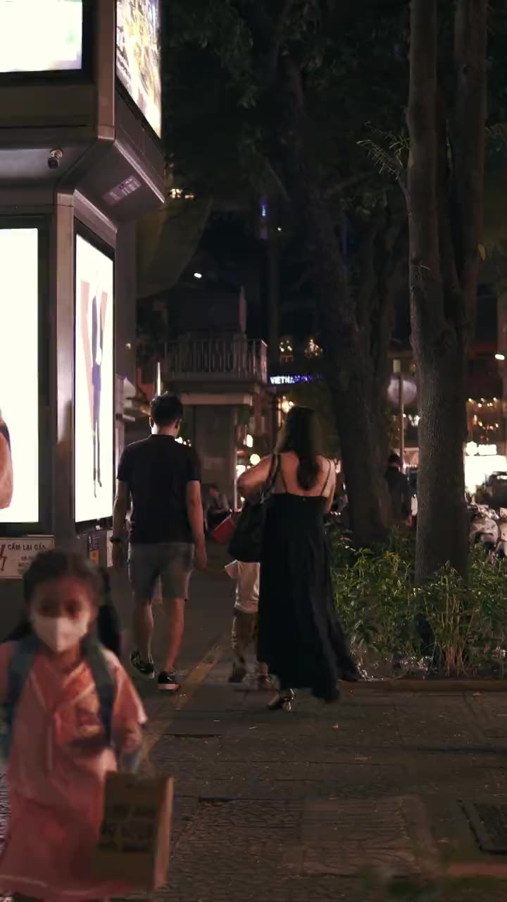 A family out for an evening walk in Ho Chi Minh City